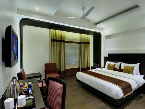 Gulta vai gultas numurā naktsmītnē Hotel Godwin Deluxe -Near New Delhi Railway Station - Paharganj