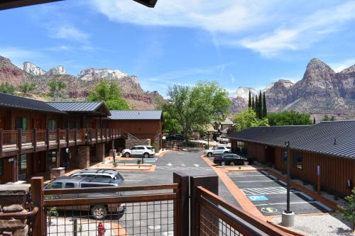 a view of a parking lot with mountains in the background at Zion Canyon Lodge in Springdale