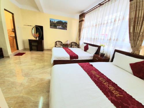 Giường trong phòng chung tại Thanh Thao Dalat Hotel