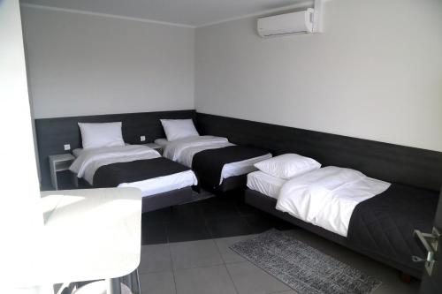 Кровать или кровати в номере Motel Dymek