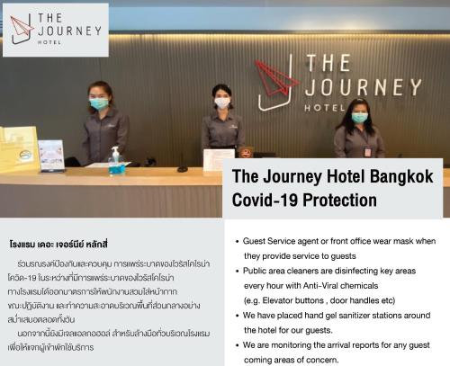 a group of people wearing face masks in a room at The Journey Hotel Laksi in Bangkok