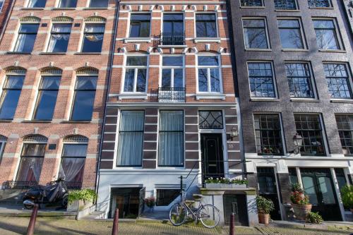 a bike parked in front of a building at B&B Blossom in Amsterdam