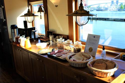 a counter with baskets of food on top at Felicitas in Amsterdam