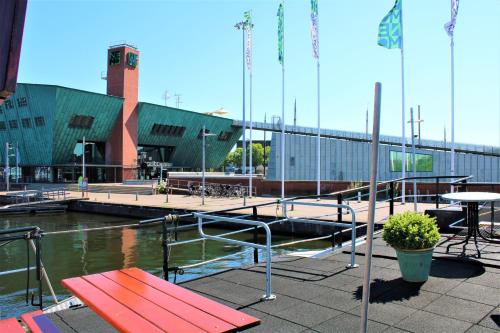 a marina with a red bench and a table at Felicitas in Amsterdam