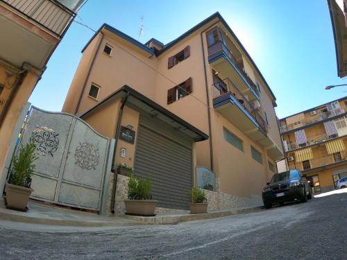 a building with a car parked in front of it at Anfitrite B&B Tropea in Tropea