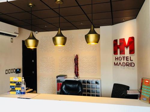 a lobby with a hotel market sign and lights at Hotel Madrid in Tuxtla Gutiérrez