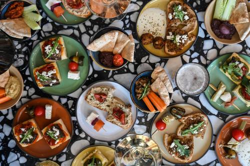 a table full of plates of food on a table at Okko Hotels Strasbourg Centre in Strasbourg