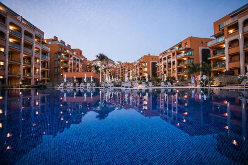 a large swimming pool in front of some buildings at Arguineguín Park By Servatur in La Playa de Arguineguín