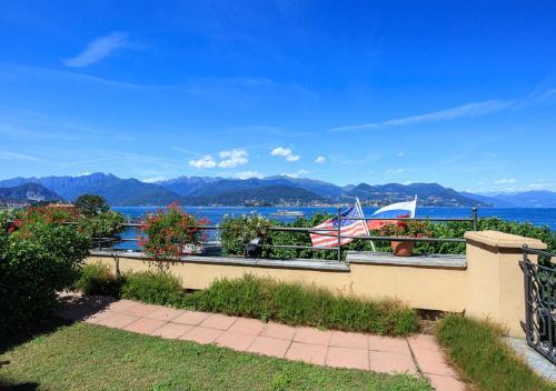 a balcony with a view of the water at Hotel Residence La Luna Nel Porto in Stresa