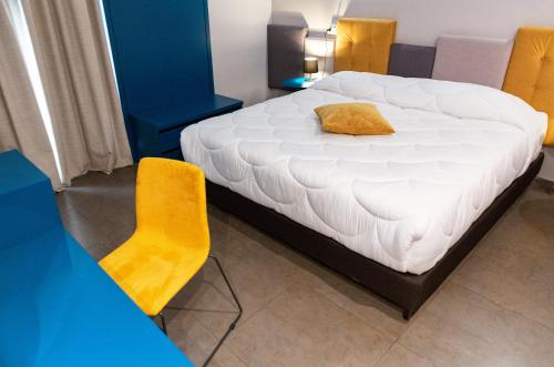 A bed or beds in a room at Hotel Eubea