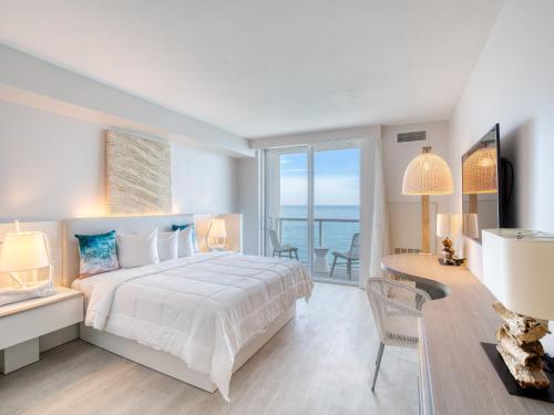 a bedroom with a bed and a view of the ocean at Daytona Grande Oceanfront Resort in Daytona Beach