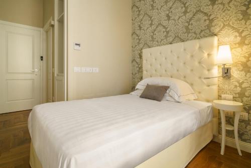 เตียงในห้องที่ Boutique Hotel Carlo Felice