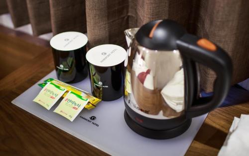 a coffee maker sitting on top of a table at Harmony Hotel in Seoul