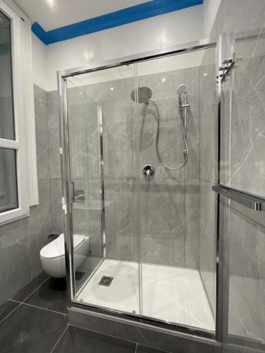 a shower stall in a bathroom with a toilet at PALAZZO FIACCADORI - Historical Palace in Reggio di Calabria