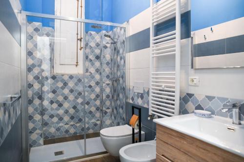 a bathroom with a toilet and a sink at Xenia Home in Reggio di Calabria