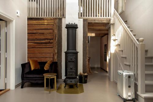 a hallway with a black stove in a house at Lilla Sand in Porvoo