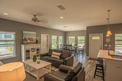 a living room with a couch and a table at Beach Daze in Panama City Beach