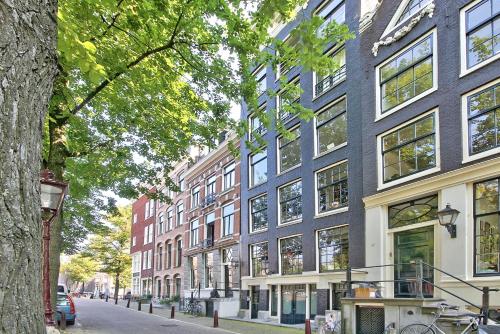 a row of tall buildings on a city street at B&B Blossom in Amsterdam