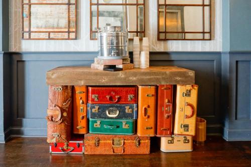 a pile of suitcases stacked on top of each other at Herbert Hotel in San Francisco