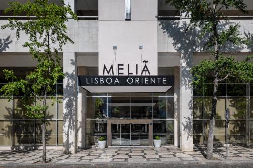 a building with a sign that reads melia usoda office at Melia Lisboa Oriente Hotel in Lisbon