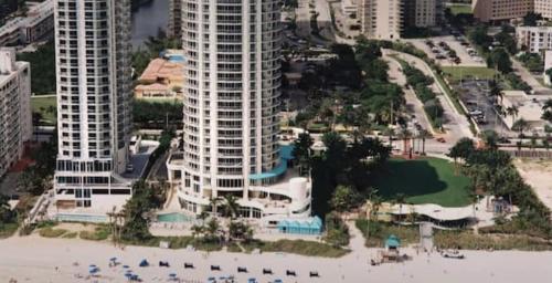 an aerial view of a large building on the beach at Best Resort Beach Front Condo in Miami Beach