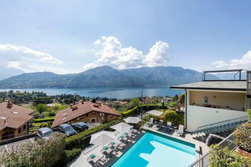 a view of the lake from a house with a swimming pool at Hotel La Perla in Tremezzo