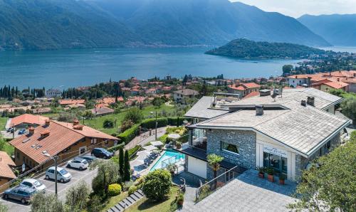 an aerial view of a house with a lake at Hotel La Perla in Tremezzo