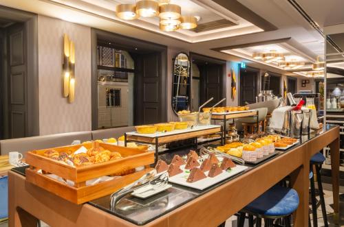 a buffet line with various food items on display at Eurostars Lisboa Baixa in Lisbon