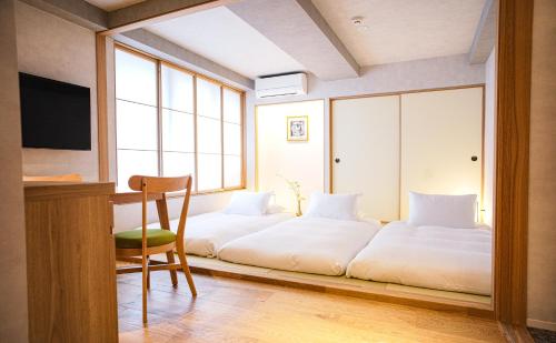 Cama ou camas em um quarto em Miru Kyoto Gion