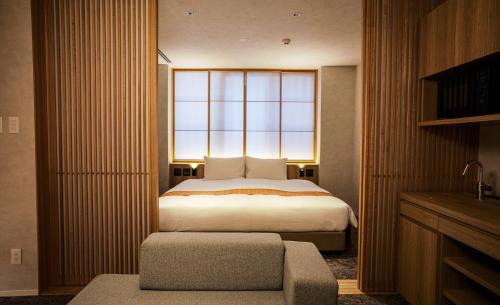 Cama ou camas em um quarto em Miru Kyoto Gion