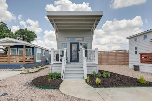 a tiny home with a porch and stairs to the door at Community Pool and Hot Tub Austin Tiny Home! in Austin