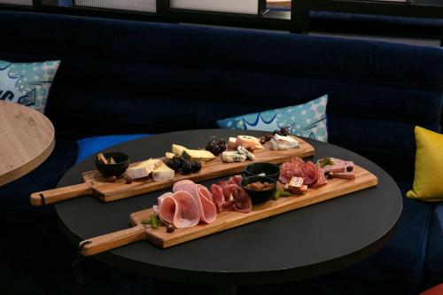 a plate of food on a table with sushi at Aloft Strasbourg Etoile in Strasbourg