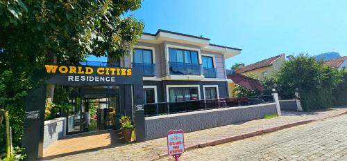 a building with a sign that reads world cities residence at World Cities in Kemer