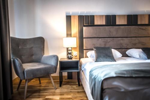 Postel nebo postele na pokoji v ubytování Hotel Sukcesor