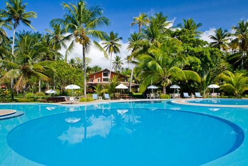 Piscina a Hotel Karapitangui o a prop