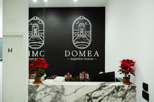 a black and white sign for a showroom at Domea Superior Rooms Bed and Breakfast in Reggio di Calabria