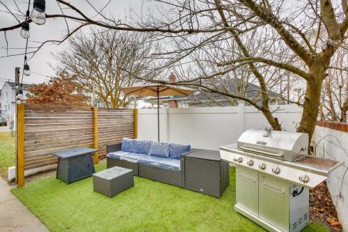 a backyard with a grill and a picnic table at Atlantic City Home about 2 Mi to Ocean Casino Resort! in Atlantic City