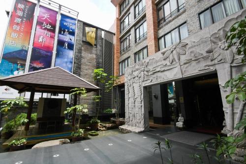 an entrance to a building with a sign on it at Einhan Resort in Yuchi