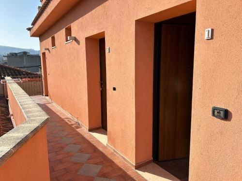 a row of doors on the side of a building at T'Addormento in Reggio di Calabria