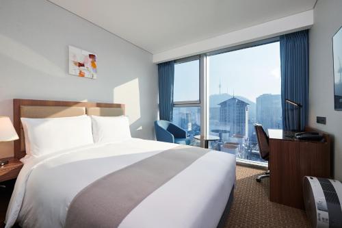 Voodi või voodid majutusasutuse Stanford Hotel Myeongdong toas