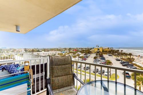 a balcony with a view of the beach and the ocean at Harbour Beach Resort Unit 518 in Daytona Beach