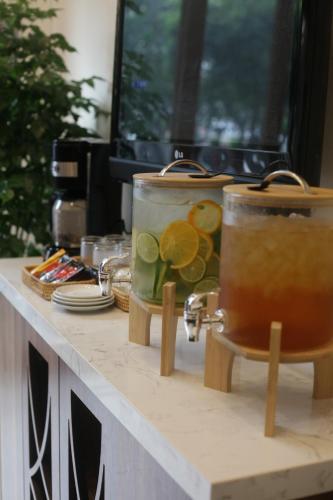 a counter top with two jars of food on it at Lantern Hotel in Ho Chi Minh City