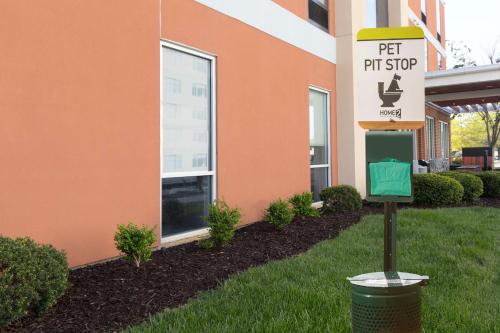 a sign for a pet store in front of a building at Newly Renovated - Home2 Suites by Hilton Knoxville West in Knoxville