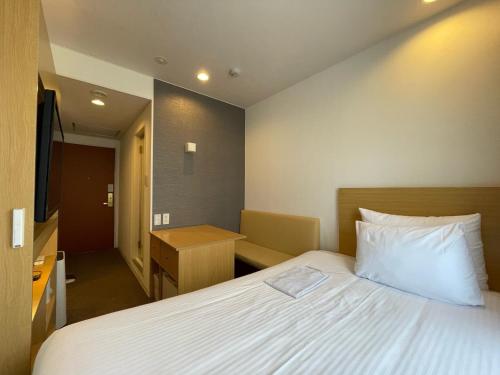 Tempat tidur dalam kamar di Hotel Passage 2