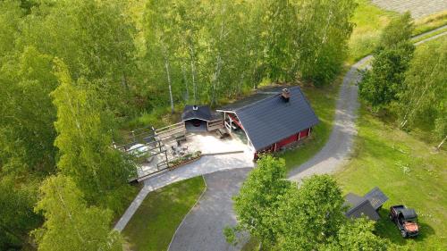 an overhead view of a house in the woods at Lomahyppäys in Naantali