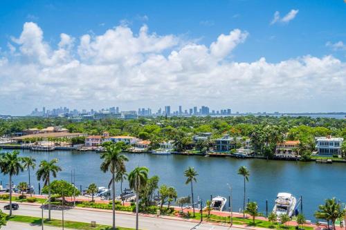 a view of a river with palm trees and a city at 2 Bedrooms Unit OceanFront Resort The Alexander in Miami Beach