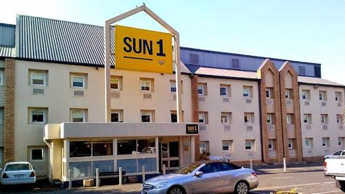 a building with a sun sign on top of it at SUN1 Durban in Durban