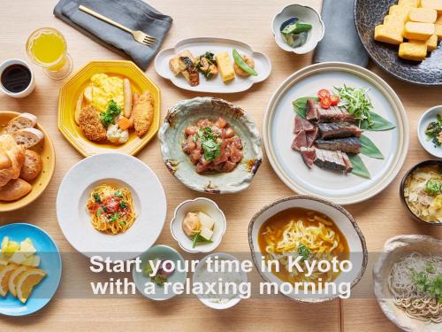 a table with plates of food on it at Mitsui Garden Hotel Kyoto Shijo in Kyoto