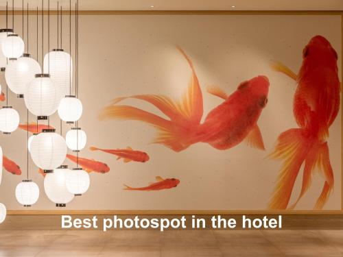 best photographer in the hotel mural of fish at Mitsui Garden Hotel Kyoto Shijo in Kyoto