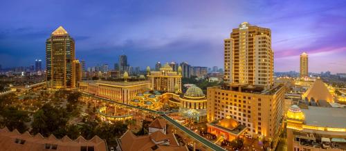 a city skyline at night with tall buildings at Sunway Resort Hotel in Kuala Lumpur